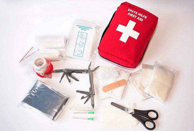 First aid kit with various medical supplies.