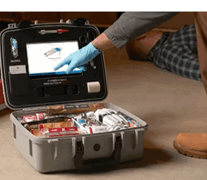 Medical kit with screen and supplies open.