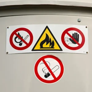 Warning signs for no wheeled vehicles, flammable material, no entry, and no smoking.